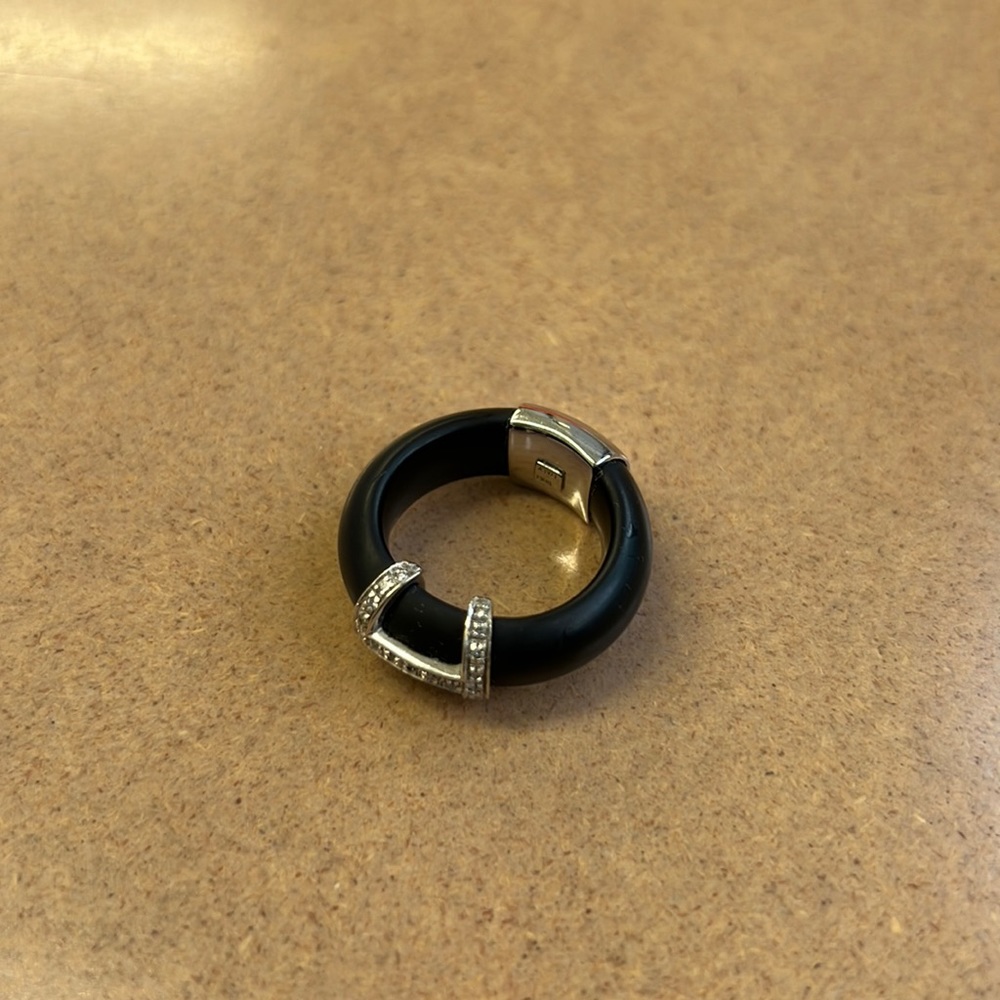 Black plastic bendable ring with silver design